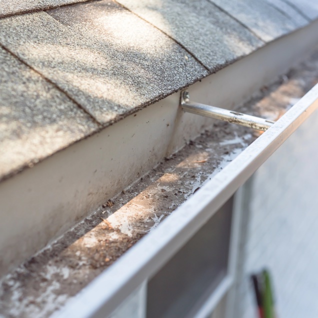 Top view clear gutter after cleaning from leaves and dirt